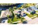 Aerial view of lakefront home and surrounding houses at 10511 Martinique Isle Dr, Tampa, FL 33647