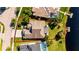 Aerial view of a single-Gathering home with a pool and private dock at 10511 Martinique Isle Dr, Tampa, FL 33647