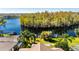 Aerial view showcasing home's lakefront location and backyard at 10511 Martinique Isle Dr, Tampa, FL 33647