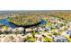 Aerial view showing home's location on a lake in a residential community at 10511 Martinique Isle Dr, Tampa, FL 33647