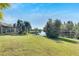 Waterfront backyard with grassy area and dock at 10511 Martinique Isle Dr, Tampa, FL 33647