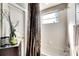 Simple bathroom with shower/tub combo and brown curtain at 10511 Martinique Isle Dr, Tampa, FL 33647