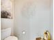 Small bathroom with toilet and decorative wall art at 10511 Martinique Isle Dr, Tampa, FL 33647