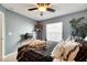 Cozy bedroom with a comfortable bed and window coverings at 10511 Martinique Isle Dr, Tampa, FL 33647