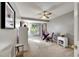 Cozy bedroom with neutral walls, carpeted floors, and a small sitting area at 10511 Martinique Isle Dr, Tampa, FL 33647