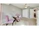 Spacious bedroom with neutral walls, carpeted floors and a small sitting area at 10511 Martinique Isle Dr, Tampa, FL 33647