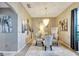 Elegant dining room with a glass table and chandelier at 10511 Martinique Isle Dr, Tampa, FL 33647