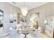 Modern dining room with glass table and stylish chairs at 10511 Martinique Isle Dr, Tampa, FL 33647