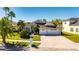 Beautiful two-story house with a three-car garage and manicured lawn at 10511 Martinique Isle Dr, Tampa, FL 33647