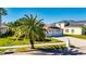 Single-Gathering home with a two-car garage and a lush green lawn at 10511 Martinique Isle Dr, Tampa, FL 33647