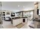 Open concept kitchen features an island with wine cooler and granite counters at 10511 Martinique Isle Dr, Tampa, FL 33647