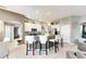 Modern kitchen with white cabinets, granite countertops, and stainless steel appliances at 10511 Martinique Isle Dr, Tampa, FL 33647