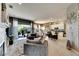 Open kitchen with white cabinets and breakfast bar at 10511 Martinique Isle Dr, Tampa, FL 33647