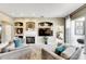 Bright and airy living room with a fireplace and views into other rooms at 10511 Martinique Isle Dr, Tampa, FL 33647