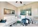 Living room with white sectional sofa and a teal accent at 10511 Martinique Isle Dr, Tampa, FL 33647