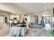 Open living space with grey sofas and kitchen views at 10511 Martinique Isle Dr, Tampa, FL 33647