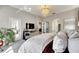 Main bedroom with TV, access to balcony and plenty of light at 10511 Martinique Isle Dr, Tampa, FL 33647