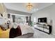 Spacious main bedroom with large windows and stylish decor at 10511 Martinique Isle Dr, Tampa, FL 33647
