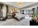 Luxurious main bedroom with a large bed and stylish decor at 10511 Martinique Isle Dr, Tampa, FL 33647