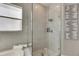Walk-in shower with glass enclosure and penny tile floor at 10511 Martinique Isle Dr, Tampa, FL 33647