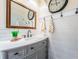 Modern bathroom with white subway tile and gray vanity at 11194 91St Ave, Seminole, FL 33772