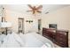 Spacious bedroom with a queen bed and dresser, plus access to the bathroom at 11194 91St Ave, Seminole, FL 33772