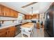 Modern kitchen with wood cabinets, a butcher block island, and stainless steel appliances at 11194 91St Ave, Seminole, FL 33772