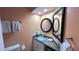 Clean bathroom with single sink, granite countertop, and large mirror at 1515 Pinellas Bayway S # 35, Tierra Verde, FL 33715