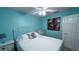 Guest bedroom with a full-size bed, dresser, and tranquil decor at 1515 Pinellas Bayway S # 35, Tierra Verde, FL 33715