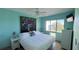 Primary bedroom with king-size bed, ceiling fan, and large window at 1515 Pinellas Bayway S # 35, Tierra Verde, FL 33715