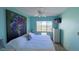 Primary bedroom with king-size bed, ceiling fan and large window at 1515 Pinellas Bayway S # 35, Tierra Verde, FL 33715