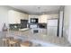 Modern kitchen with white cabinets and granite countertops at 1515 Pinellas Bayway S # 35, Tierra Verde, FL 33715
