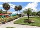 Community pool and kayak storage with lush landscaping at 1515 Pinellas Bayway S # 35, Tierra Verde, FL 33715