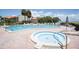 Inviting heated pool and spa with surrounding lounge chairs at 1515 Pinellas Bayway S # 35, Tierra Verde, FL 33715