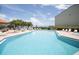 Relaxing community pool with plenty of lounge chairs at 1515 Pinellas Bayway S # 35, St Petersburg, FL 33715