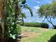 Stunning waterfront view with lush landscaping and calm water at 1515 Pinellas Bayway S # 35, Tierra Verde, FL 33715