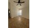 Spacious bedroom with ceiling fan and large window at 18005 Palm Breeze Dr, Tampa, FL 33647