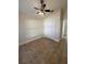 Bright bedroom with ceiling fan and double door closet at 18005 Palm Breeze Dr, Tampa, FL 33647