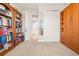 Bedroom with built-in shelving and view of bathroom at 2101 Sunset Wind Loop, Oldsmar, FL 34677