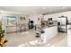 Open kitchen with island and view into living room at 2101 Sunset Wind Loop, Oldsmar, FL 34677