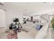 Spacious living room with sectional sofa and large TV at 2101 Sunset Wind Loop, Oldsmar, FL 34677