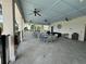 Relaxing pool area with seating and ceiling fans at 2101 Sunset Wind Loop, Oldsmar, FL 34677