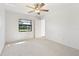 Bedroom with window overlooking backyard at 2122 Hereford Dr # 511, Sun City Center, FL 33573