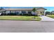 Single-story home with a well-manicured lawn and driveway at 2122 Hereford Dr # 511, Sun City Center, FL 33573