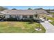Single-story home with a paved driveway and well-maintained lawn at 2122 Hereford Dr # 511, Sun City Center, FL 33573