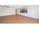 Bright living room featuring light walls and wood-look floors at 2122 Hereford Dr # 511, Sun City Center, FL 33573