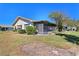 Screened porch with backyard access and lush landscaping at 2122 Hereford Dr # 511, Sun City Center, FL 33573