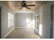 Sunroom with tile floors, ceiling fan and French doors at 3515 Buckboard Ln, Brandon, FL 33511