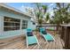 The wooden deck boasts lounge chairs and a charming outdoor space for relaxation and backyard enjoyment at 3918 W Fig St, Tampa, FL 33609