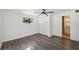 Bedroom with modern flooring, natural light and a ceiling fan next to a bathroom at 3918 W Fig St, Tampa, FL 33609